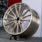 Audi RS E-TRON GT FW 21 inch custom forged wheels | P103SC style Brushed with Gold coating finish, three-quarter view on display stand showing multi-spoke Y-geometry