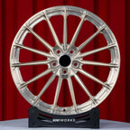 Audi RS E-TRON GT FW 21 inch custom forged wheels | P103SC style Brushed with Gold coating finish, straight front view on red backdrop showing intricate multi-spoke arrangement