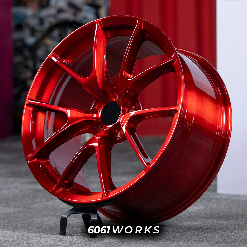 Audi RS3 8Y 18 inch custom forged wheels | Apex VS-5RS style Glossy Candy Red finish, three-quarter view on display stand highlighting lightweight motorsport split 5-spoke geometry