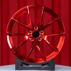 Audi RS3 8Y 18 inch custom forged wheels | Apex VS-5RS style Glossy Candy Red finish, straight front view on display stand showcasing track-inspired split-spoke design