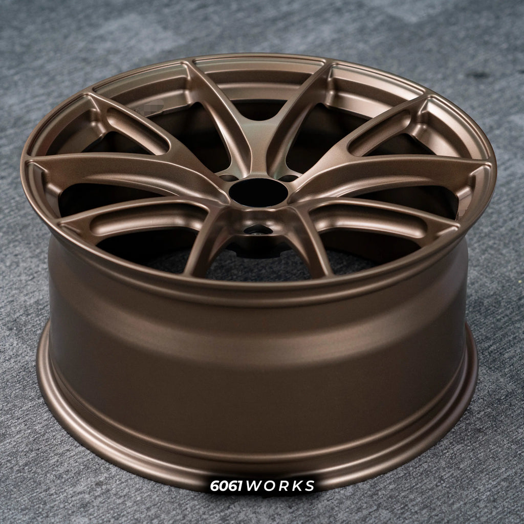 Audi RS3 8Y 18 inch custom forged wheels | Apex VS-5RS style Satin Bronze finish, top-down angled profile view showing full wheel width and inner barrel