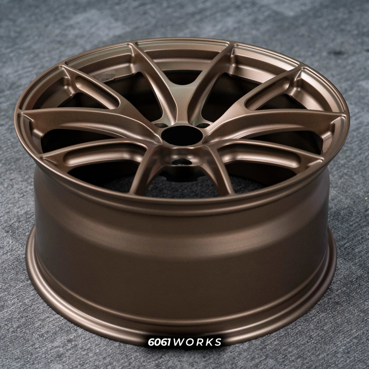 Audi RS3 8Y 18 inch custom forged wheels | Apex VS-5RS style Satin Bronze finish, top-down angled profile view showing full wheel width and inner barrel