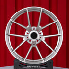 BMW G80 M3 G82 M4 19 20 inch custom forged wheels | OEM BMW 763M style Satin Gold finish, straight front view on red backdrop displaying Motorsport-inspired 5 Y-spoke pattern