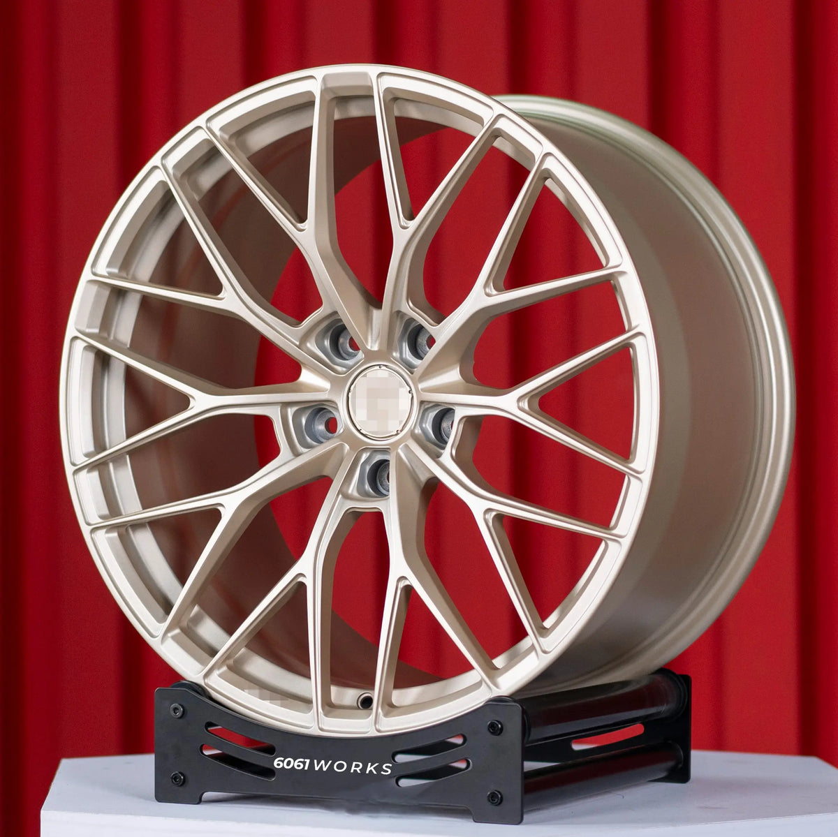 Custom forged wheels Anrky AN10 style for BMW G80 M3 G82 M4 20 inch | Satin Gold, angled front view on stand