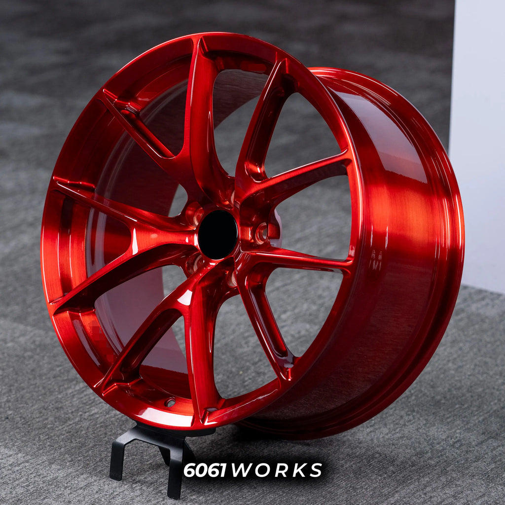 BMW M2 G87 19 inch custom forged wheels | Apex VS-5RS style Glossy Candy Red finish, dynamic side-angle view displaying deep concave profile and high-gloss translucent red coat