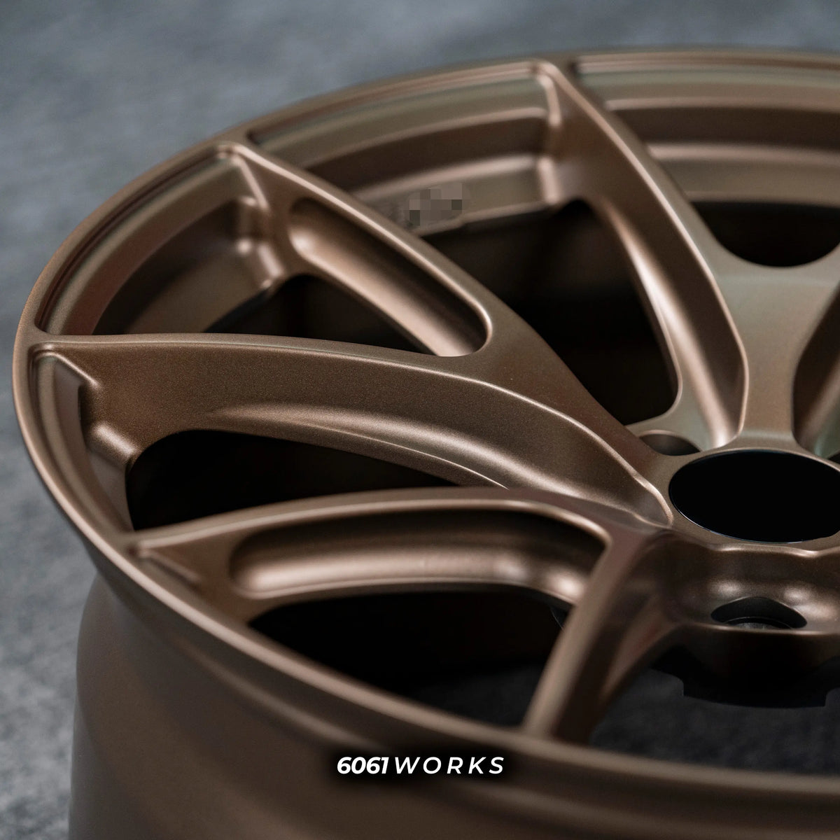 BMW M2 G87 19 inch custom forged wheels | Apex VS-5RS style Satin Bronze finish, extreme macro close-up showing split-spoke milling and smooth matte bronze texture