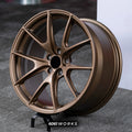 BMW M2 G87 19 inch custom forged wheels | Apex VS-5RS style Satin Bronze finish, dynamic side-angle view displaying deep concave profile and satin bronze coat