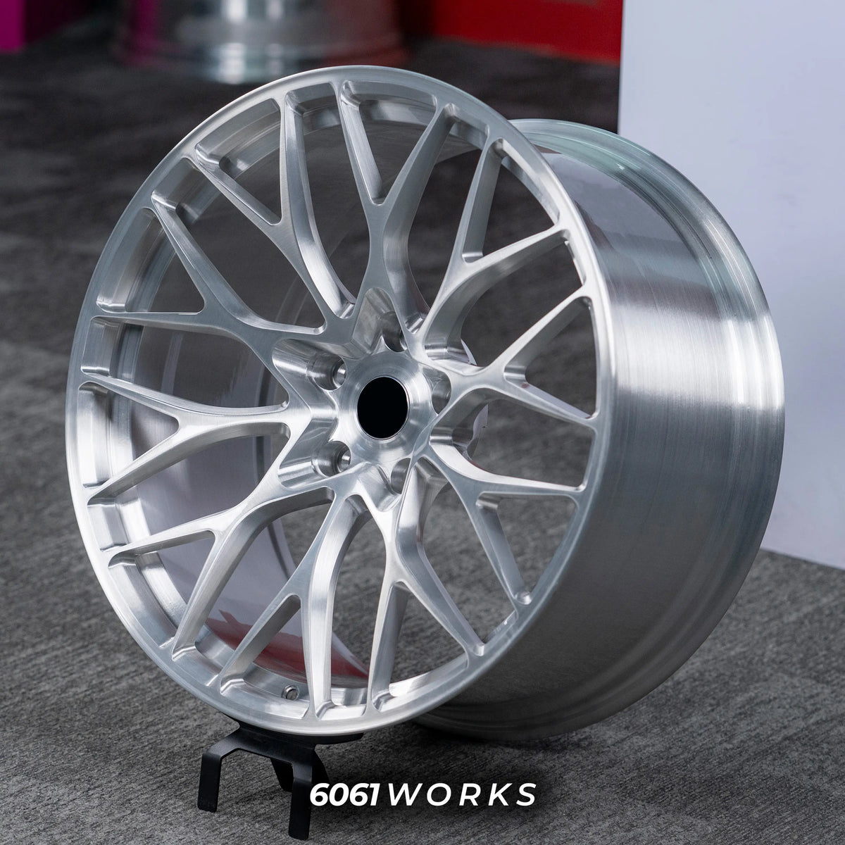 BMW M4 G82 20 21 inch custom forged wheels | 520M style Brushed Silver finish, dynamic side-angle view on gray background displaying hand-brushed metallic texture and rim lip
