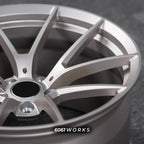 BMW M5 G90 22 inch custom forged wheels | OEM BMW 763M style Satin Gold finish, detailed macro view on satin gold spoke contours and outer rim edge
