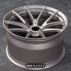 BMW M5 G90 22 inch custom forged wheels | OEM BMW 763M style Satin Gold finish, top-down angled profile view showing full wheel width and inner barrel