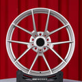BMW M5 G90 22 inch custom forged wheels | OEM BMW 763M style Satin Gold finish, straight front view on red backdrop displaying Motorsport-inspired 5 Y-spoke pattern