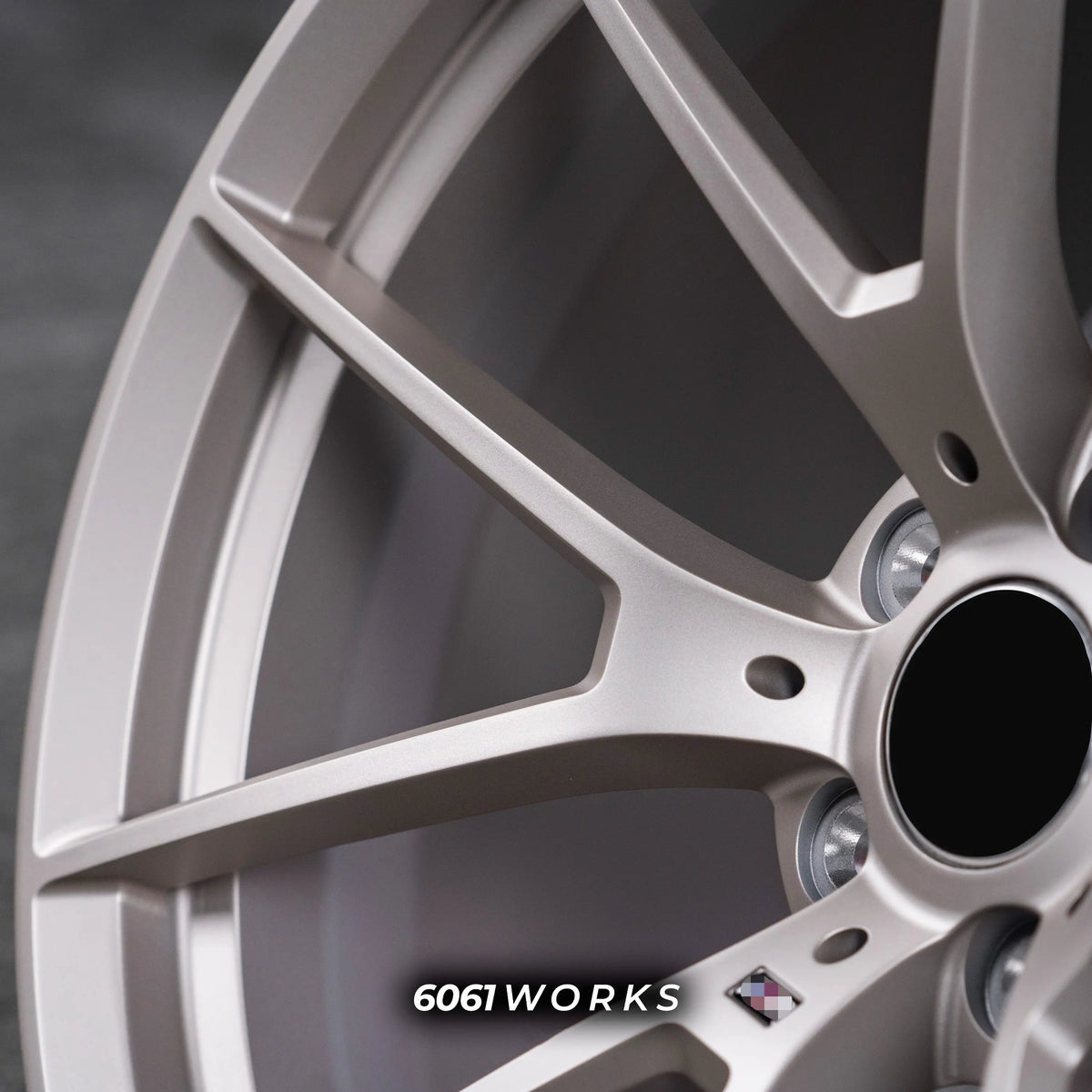 BMW M5 Touring G99 22 inch custom forged wheels | OEM BMW 763M style Satin Gold finish, extreme macro close-up highlighting smooth matte satin gold texture and Y-spoke detailing