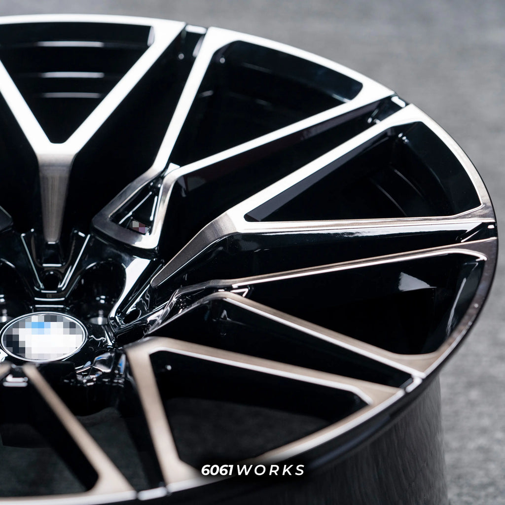 BMW X6 G06 22 inch custom forged wheels | OEM BMW 818M style Gloss Black with Machined Face Dark Coating, detailed close-up shot of the outer lip and machined edge under direct lighting