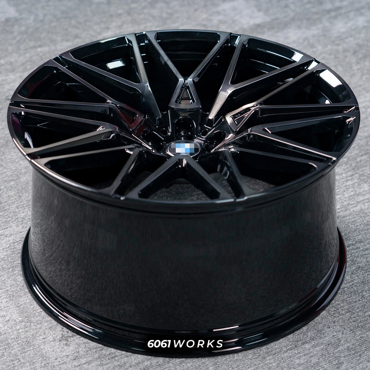 BMW X6 G06 22 inch custom forged wheels | OEM BMW 818M style Gloss Black with Machined Face Dark Coating, top-down angled profile view showing full wheel width and inner barrel