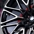 BMW X6 G06 22 inch custom forged wheels | OEM BMW 818M style Gloss Black with Machined Face Dark Coating, extreme macro close-up showing precision split-spoke machining and dark tint contrast