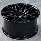 BMW X6M F96 LCI 21 22 inch custom forged wheels | OEM BMW 818M style Gloss Black with Machined Face Dark Coating, top-down angled profile view showing full wheel width and inner barrel
