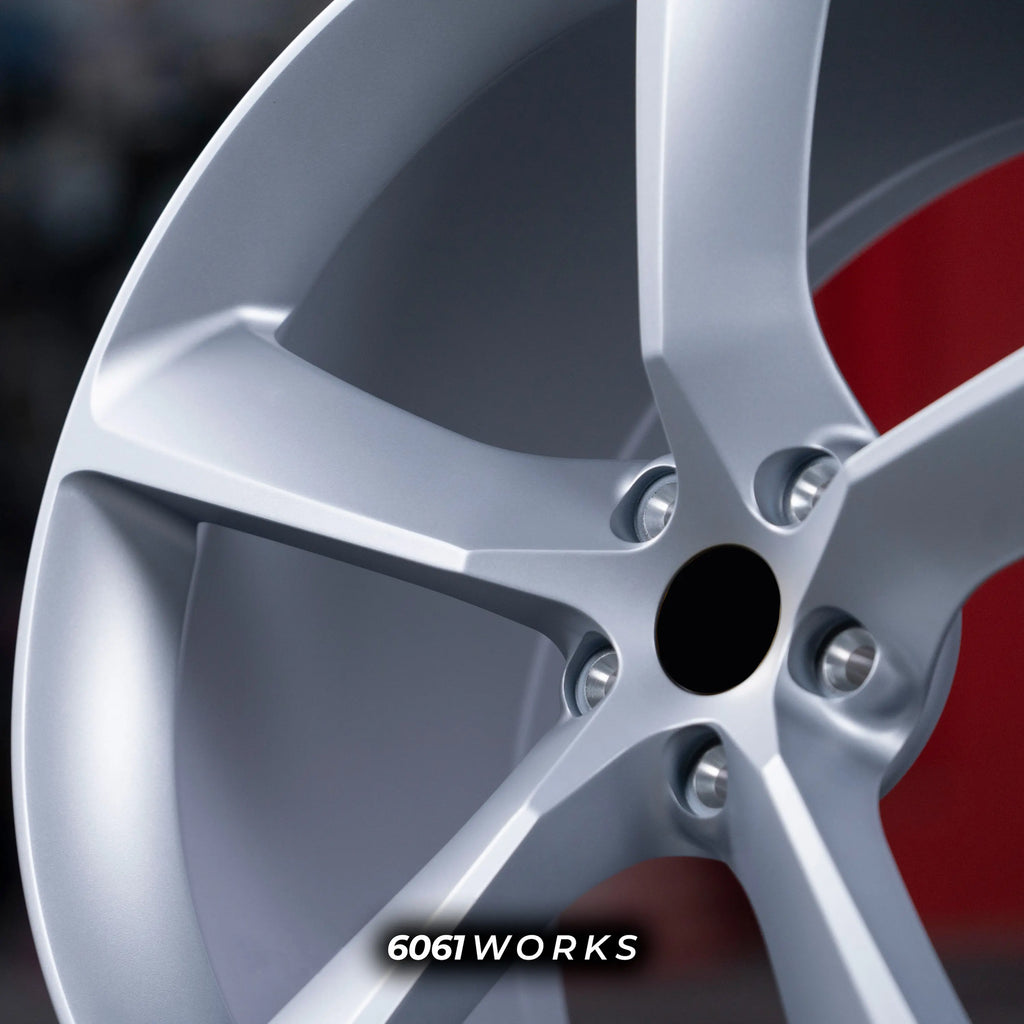 Ferrari 488 20 inch custom forged wheels | OEM Ferrari Monza SP1 style Satin Silver finish, extreme macro close-up of center bore, lug holes, and refined satin metallic surface