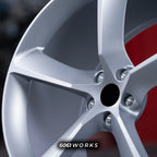 Ferrari 488 20 inch custom forged wheels | OEM Ferrari Monza SP1 style Satin Silver finish, extreme macro close-up of center bore, lug holes, and refined satin metallic surface
