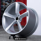 Ferrari GTC4Lusso 21 22 inch custom forged wheels | OEM Ferrari Monza SP1 style Satin Silver finish, three-quarter view on display stand highlighting subtle concave 5-spoke design