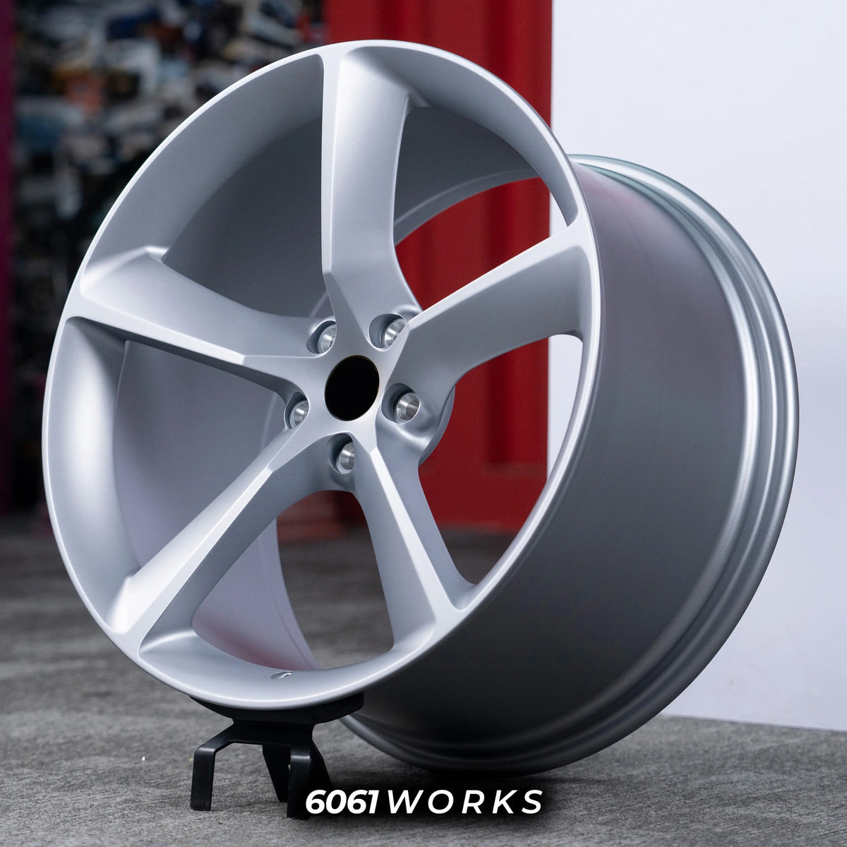 Ferrari Purosangue 22 23 inch custom forged wheels | OEM Ferrari Monza SP1 style Satin Silver finish, three-quarter view on display stand highlighting subtle concave 5-spoke design