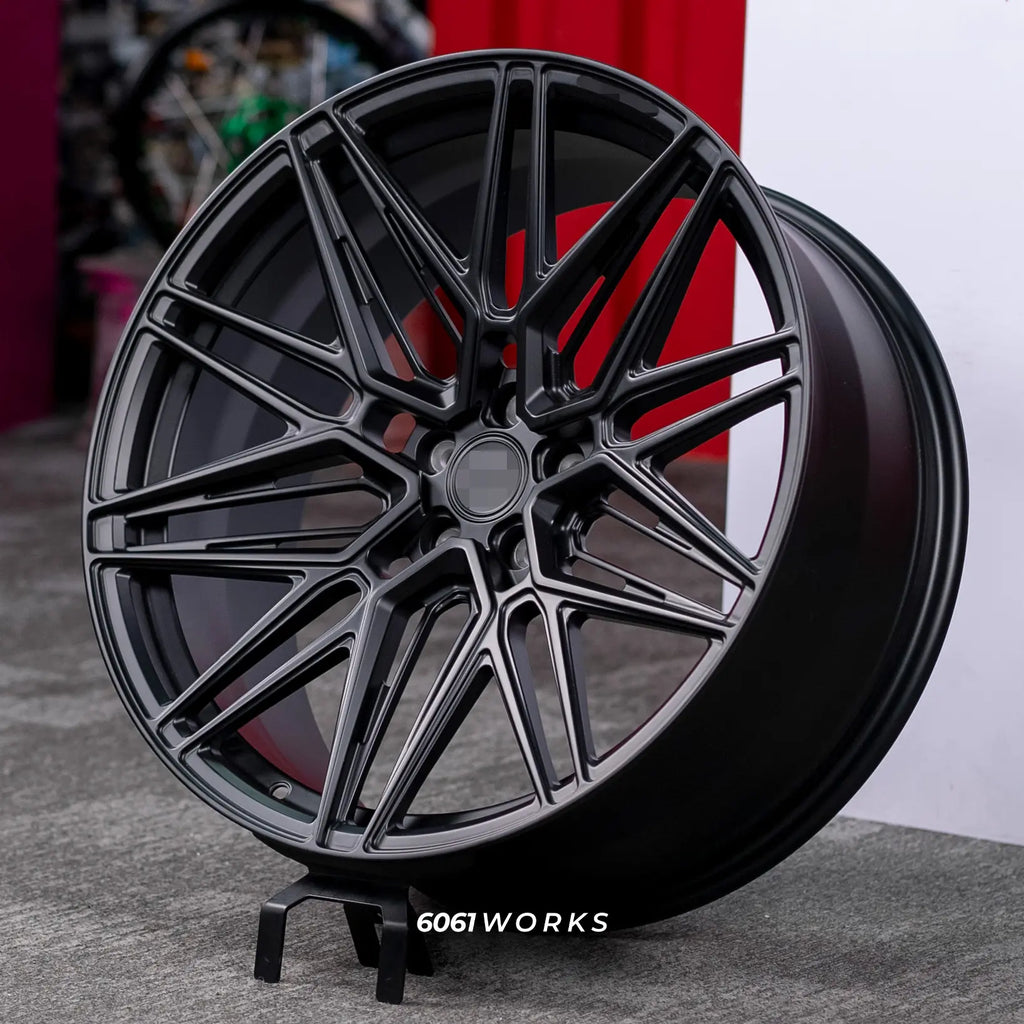 Lamborghini Urus SE Performante 22 inch custom forged wheels | Vossen HF-7 style Satin Black, dynamic three-quarter display view on stand