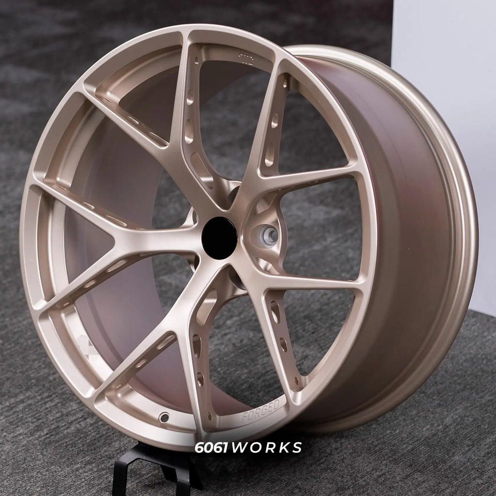 McLaren 600LT 20 21 inch custom forged wheels | BBS FI-R style Satin Gold, dynamic angled display view on stand