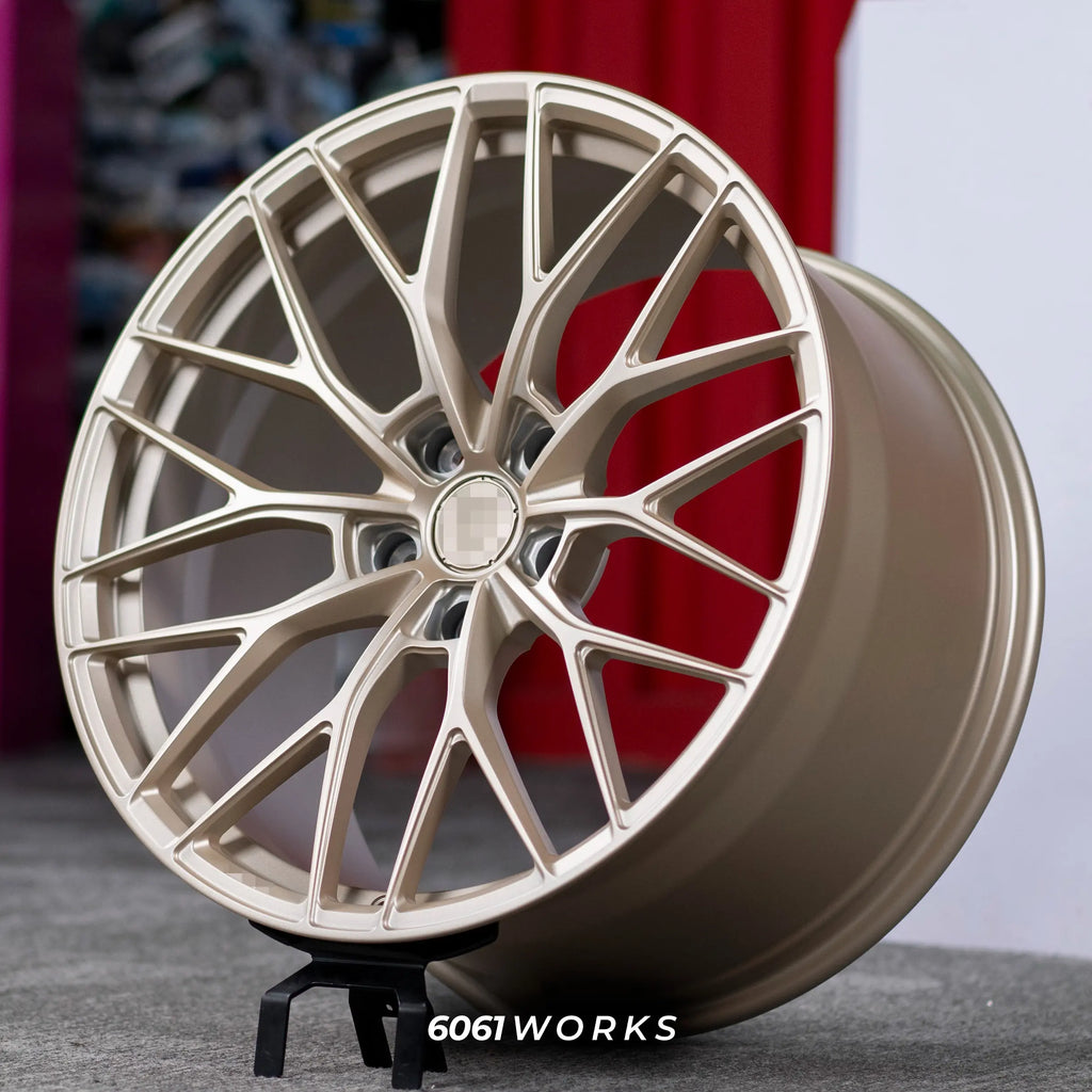 Custom forged wheels Anrky AN10 style for McLaren 720S 20 21 inch | Satin Gold, angled display view on stand
