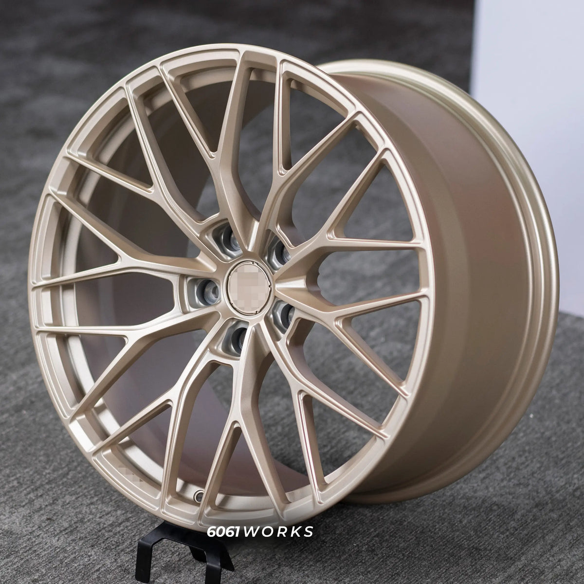 McLaren 720S 20 21 inch custom forged wheels | Anrky AN10 style Satin Gold, angled view on stand