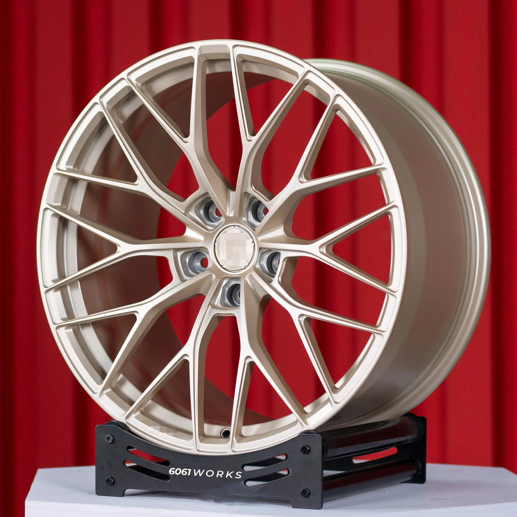 Custom forged wheels Anrky AN10 style for McLaren 720S 20 21 inch | Satin Gold, angled front view on stand