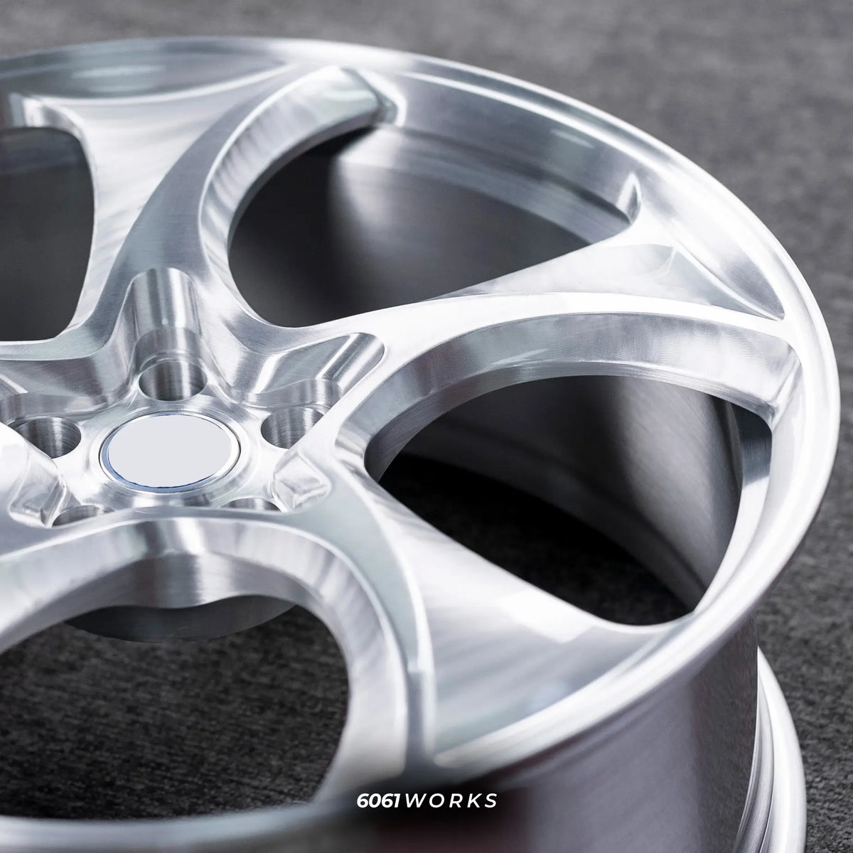 Porsche 911 992.2 Carrera 20 21 inch custom forged wheels | 522M style Brushed finish, detailed macro view on brushed aluminum spoke contours and outer rim edge