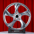 Porsche Taycan 21 inch custom forged wheels | 522M style Polished finish, straight front view on red backdrop displaying directional 5-spoke design