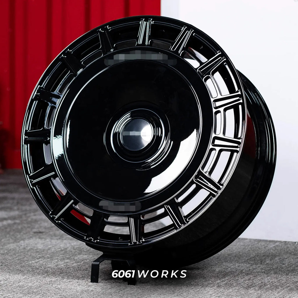Rolls Royce Phantom 24 inch custom forged wheels | Mansory FD.15 style Gloss Black, dynamic angled display view on stand